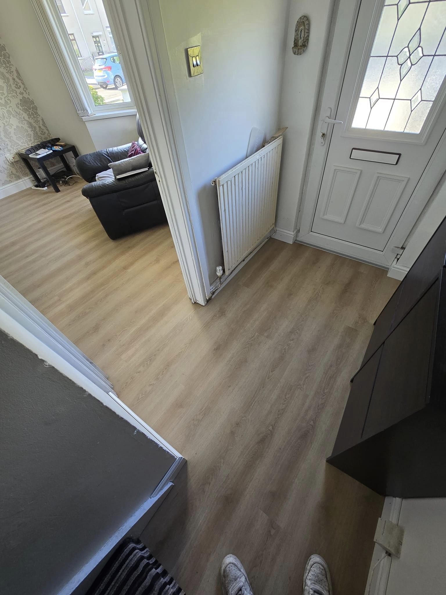 Lounge and entrance hall done with laminate flooring